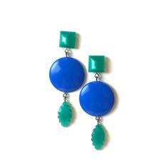 Cornflower blue meet emerald green geometric shapes cascade in these elegant and retro-vibe statement earrings. Each earring measures just about 3" length & are super light weight. Earrings are made with mostly vintage lucite parts that were made in the US in the 1960's - early 80's. We hand-set them with surgical steel earring posts and they have sturdy surgical steel/acrylic backings on them as well. Retro Blue Drop Earrings Jewelry, Retro Blue Drop Earrings, Retro Blue Earrings For Pierced Ears, Retro Blue Party Earrings, Retro Green Earrings For Party, Green Retro Party Earrings, Surgical Steel Earrings, Moon Glow, Earring Posts