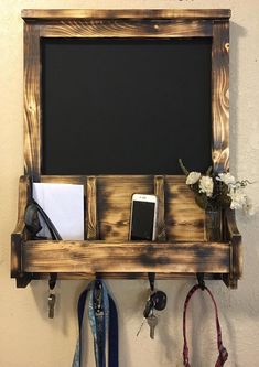 there is a chalkboard and cell phone on the shelf