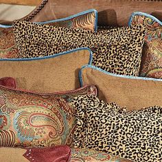 leopard print pillows are stacked on top of each other