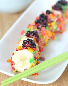 this kid - friendly breakfast sushi is made with cereal and fruit