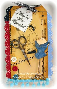 an altered card with scissors and sewing related items