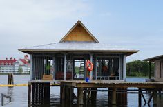 a boat dock with some people standing on it