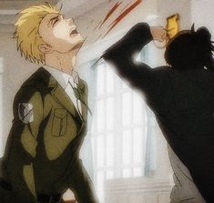 an anime scene with two people in the background and one holding a cell phone up to his ear