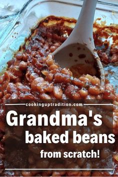 grandma's baked beans from scratch in a casserole dish with a spoon