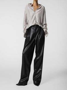 Loose fit vegan leather trousers with low waist, double pleated waistband and belt loops. Made from high quality PU. Fabric contains natural stretch. Model is in MINUSEY S. ✔️ Free worldwide express shipping over $100✔️ Loved by 6,500+ customers✔️ Limited edition collections, maximum styleStay ahead of the trend with can’t-find-anywhere-else staples. Your closet will thank you 💕* MINUSEY S = EU 34, US 2* MINUSEY M = EU 36, US 4* 100% PU Leather* Hand wash cold or professional clean* Made in Korea - Model Height: 169cm/5'6" (US2, EU34) Sleek Leather Pants With Belt Loops For Work, Sleek Leather Straight Pants With Belt Loops, Sleek High-waisted Leather Pants With Belt Loops, Sleek Straight Leather Pants With Belt Loops, Business Casual High-waisted Leather Pants With Belt Loops, High-waisted Leather Pants For Business Casual With Belt Loops, Business Casual High-waisted Leather Pants, Wide Leg Leather Pants With Belt Loops For Work, Leather Belted Bottoms For Work