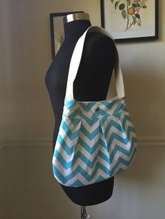 "Handmade, one-of-a-kind, and ready to ship! Your order will go out in 1-2 business days. Simple and stylish, the Charlie bag is the perfect everyday accessory.  Ideal for use as a purse, school bag, smaller diaper bag, overnight bag, travel tote, or market bag. iPad and tablet-friendly. Reinforced at all stress points with careful attention to detail.  :: exterior :: Made from durable cotton canvas fabric in Blue Chevron. :: interior :: Lining is made from 100% cotton heavy duck canvas in an off-white natural color. Durable, water-resistant, and long lasting.   Four interior pockets are included: 2 medium sized pockets on one side, and a larger pocket and a pen slip on the other.  The bag closes with a heavy snap, professionally pressed for extra durability. :: strap :: Cotton webbing str Rainbow Purses, Multi Pocket Bag, Dress Purse, Cotton Handbag, White Shoulder Bag, Tapestry Bag, Stylish Purse, Canvas Purse, Hippie Bags