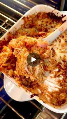 a casserole dish with meat and cheese in it is being cooked on the stove