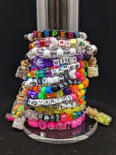 BRACELETS ARE ASSORTED SIZES FROM 6.5-9IN CIRCUMFRENCE -Kandi bracelets featuring handmade glass vial charms -Made with elastic cord -You will receive all the bracelets pictured -You will receive exactly what's pictured in the photos -For bracelets with charms they are made of GLASS and can break.  They are removable from the kandi via double jump ring if you don't wish to wear them.  Vials are glued shut and aren't openable. -Handmade pony bead kandi bracelets -Majority of bracelets are made with traditional pony beads, but some bracelets include mini beads, round acrylic, tri beads, etc. -These bracelets are premade and not customizable.  -Made with black elastic cord, not clear crystal string. -Please note that bracelets in this lot vary in size.  Shipping within the US USPS First Class Clear Beaded Bracelets For Gift, Clear Beaded Bracelets As A Gift, Handmade Clear Beaded Bracelets As Gift, Bead Kandi, Bracelets With Charms, Glitter Rainbow, Kandi Bracelets, Glass Vials, Pony Beads