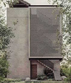 an exterior view of a house with stairs leading up to it