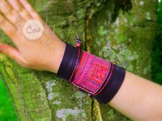 This hippie bracelet is 100% handmade from the finest quality brown leather. It is beautifully designed with vintage Hmong fabric on the front. No sewing machines or assembly lines are in sight. The Hmong tribe are an ethnic hill tribe group which lived near me in the mountains in the north of Thailand. The fabric insert used in this bracelet is Hmong vintage tribal tapestry which is beautifully cross stitched. An enormous amount of care and energy goes into making each bracelet. It has beautifu Traditional Black Friendship Bracelets For Festival, Black Bohemian Bracelets For Festivals, Unique Festival Wristband Bracelet, Traditional Leather Bracelet, Traditional Handmade Wristband For Festivals, Handmade Traditional Leather Bracelet, Traditional Handmade Black Cuff Bracelet, Bohemian Leather Bangle Bracelet For Festival, Adjustable Leather Bangle Bracelet For Festivals