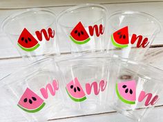 five clear cups with watermelon stickers on them