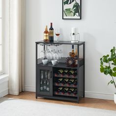 there is a wine rack with many bottles and glasses on it