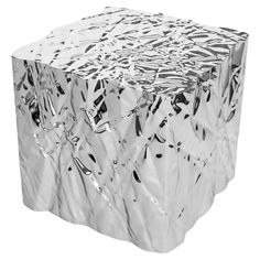 Wrinkled steel cube side table by Omaha-based designer Christopher Prinz, who achieves this unusual texture by repeatedly creasing a thin sheet of steel, resulting in a strong, rigid, and unique form. Hidden leveling feet protect surfaces and ensure balance. Made to order in 6-8 weeks. Easily customizable and available in a range of both raw and polished finishes. Please note that pieces with polished finishes are priced higher due to the more laborious plating process that they require. Cube tables in the raw finishes are priced at $6500 and are priced at $7500 in the polished finishes. CHRISTOPHER PRINZ is an Omaha-based designer seeking to expose extreme and rarely-visible possibilities of materials associated with manufacturing. His works are shaped using a repetitive, large-scale stee Cube Side Table, Cube Table, Rhode Island, Industrial Design, Table Furniture, Mirror Table, Side Table, Stainless Steel, Texture