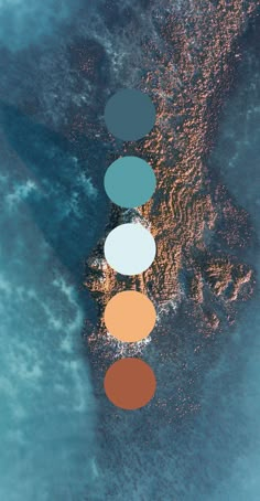 an aerial view of the ocean with five different colored circles in front of each other