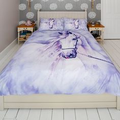 a bed with a white horse on it