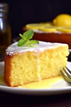 a slice of lemon cake on a plate with a fork