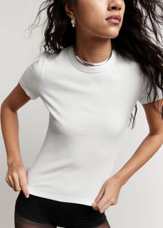 Cropped t-shirt featuring short sleeves and a round neckline.• Slim fit• Length of t-shirt:51cm / 20" (EU 36 / UK 8 / US 4) Neckline Slimmer, Rib Top, Cropped T Shirt, Professional Outfits, Fashion Story, Crop Tshirt, Vintage Jeans, White Tops, Feminine Style