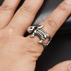 If you're searching for a unique and bold ring that stands out from the crowd, look no further than this adjustable unisex skeleton ring. Perfect for bikers, baristas, or bartenders, this eye-catching piece will ensure you always make a lasting impression. Embrace your individuality and showcase your edgy style with this unforgettable accessory. Why You'll Love It An eye-catching design: Get rid of the boring rings and get your hands on this uniquely impressive skeleton ring. Stand out in a crow Adjustable Punk Metal Rings, Adjustable Metal Punk Rings, Adjustable Punk Style Metal Rings, Adjustable Punk Rings For Halloween, Adjustable Silver Skull Ring Punk Style, Adjustable Silver Skull Ring In Punk Style, Adjustable Metal Skull Ring Punk Style, Adjustable Metal Punk Skull Ring, Adjustable Metal Skull Ring In Punk Style