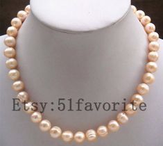 Jewelry: real cultured fresh water pearl color: natural pink color Size: about 10-11mm Grade: A have natural blemish and growth rings on pearls' surface! Length: offer different length Handwork: knotted between every 2 pearls clasp: alloy Shipping: I will send out your order in 1-5 business days. Usually will take about 25-50 business days. As seller, I really hope you will receive your parcel the earlier the better. Good luck! Elegant Peach Necklaces With Round Beads, Elegant Peach Round Beads Necklaces, Gift Round Peach Necklace, Peach Necklace Gift, Peach Round Necklace Gift, Round Peach Necklace For Gift, Peach Round Necklace For Gift, Pink Round Pearl Necklace Gift, Pink Round Pearl Necklace