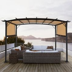 an outdoor living area with wicker furniture