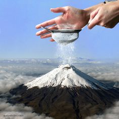 a person pouring water into a bowl on top of a mountain