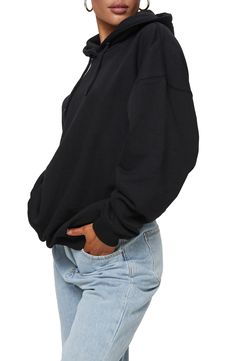 A slouchy, oversized fit lets you enter full relaxation mode the minute you slip on this cozy hoodie. Drawstring hood   Ribbed cuffs and hem   52% recycled polyester, 48% organic cotton   Machine wash, line dry   Imported Black Relaxed Fit Cozy Hoodie, Cozy Oversized Hoodie With Ribbed Cuffs, Comfy Oversized Black Sweatshirt, Comfy Black Relaxed Fit Hoodie, Comfortable Black Relaxed Fit Hoodie, Comfortable Black Hoodie With Relaxed Fit, Oversized Cozy Black Hoodie, Comfortable Oversized Sweatshirt With Drawstring Hood, Oversized Comfy Sweatshirt With Adjustable Hood