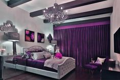 a bedroom decorated in purple and silver