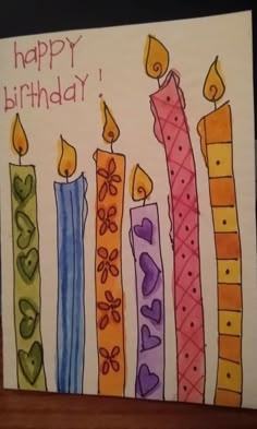 a birthday card with candles and hearts on it