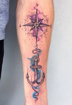 an anchor and compass tattoo on the leg