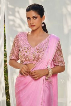 Pink pre-draped saree with an embroidered border. Paired with a padded sequin and pearl embroidered blouse. - Aza Fashions V-neck Blouse Piece For Diwali Reception, Saree With Unstitched Blouse For Reception, Festive Blouse With Dupatta In Chinon, Fitted Draped Traditional Wear With Mirror Work, Traditional Drape Blouse With Dupatta For Wedding, Wedding Blouse With Traditional Drape And Dupatta, Traditional Drape Wedding Blouse With Dupatta, Traditional Wedding Blouse With Dupatta, Saree Blouse With Resham Embroidery For Reception