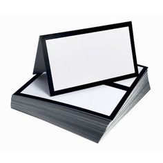 stack of blank cards with black edges on white background for use in business or product presentation