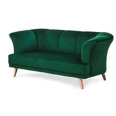 a green velvet sofa with wooden legs