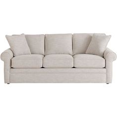 a white couch with four pillows on it