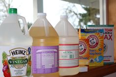 several bottles of liquid sitting on top of a counter