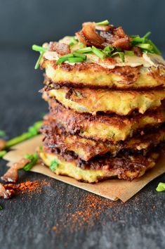 a stack of food sitting on top of a piece of paper next to some spices