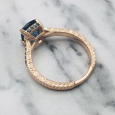 Meticulously handcrafted and forged in designer detail, it is an avant-garde styled ring for women of all ages. Follow our etsy shop become our members can get new tips on products on time and also get 10% off on new products. https://www.etsy.com/shop/AlphaJewelryCompany Luxury Topaz Wedding Ring With Birthstone, Luxury Topaz Promise Ring With Birthstone, Heirloom Topaz Ring For Promise, Heirloom Blue Topaz Diamond Cut Ring, Gold Blue Topaz Ring For Promise, Gold Blue Topaz Promise Ring, Sapphire Topaz Ring With Diamond Cut For Anniversary, Heirloom Blue Topaz Ring With Diamond Cut, Luxury Blue Topaz Solitaire Ring