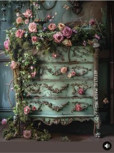 an old dresser is covered in flowers and vines