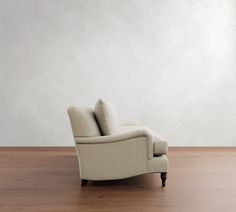 a white chair sitting on top of a hard wood floor