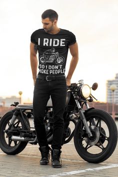 "Express your love for riding with the I Ride so I Don't Choke People Motorcycle T-shirt. Made from soft and comfortable 100% cotton, this premium quality T-shirt is perfect for anyone who loves to hit the road on their motorcycle. Featuring a hilarious and relatable design, the T-shirt showcases the phrase \"I Ride so I Don't Choke People\" in bold letters. The design is printed using high-quality, fade-resistant inks that will keep the T-shirt looking great even after multiple washes. With a classic fit and a ribbed crew neck, the I Ride so I Don't Choke People Motorcycle T-shirt is suitable for both men and women. It has short sleeves and a comfortable, relaxed fit, making it perfect for wearing on the road or out and about. Available in a range of sizes, the I Ride so I Don't Choke Peo Native American Protest, Gopro Case, Angel T Shirt, Kids Umbrellas, Motorcycle Tshirts, Beauty Store, All Music, Night Shirt, Look Plus