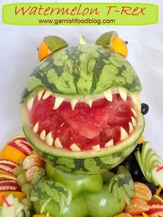 a watermelon sculpture made to look like a monster