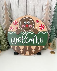 a welcome sign with gingerbreads and candy canes