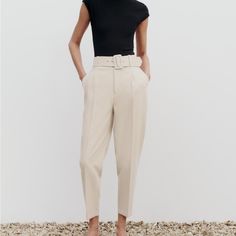 Brand New With Tags High Waisted Belted Ankle Length Trousers From Zara. Fabric Covered Belt. Ecru / Beige Color. Perfect For Work, Goes With Everything From Zara Site: Ankle Length Pants With A High Waist With Tonal Lined Belt And Front Pleats. Front Pockets And Back False Welt Pockets. Front Zip, Inner Button, And Metal Hook Closure. New With Tags. No Flaws. True To Size S. Cream Pants With Belt Loops For Work, Chic Cream Pants With Belt Loops, Fitted Beige Belted Pants, Beige Belted Bottoms For Work, Beige Belted Pants For Work, White Belted Pants For Work, Chic White Bottoms With Belt, High Waist Cream Bottoms For Office, Chic Cream Tapered Leg Bottoms