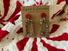 Welcome to my shop.  If you love glitter you have come to the right place. These Christmas multi color chunky glittery resin earrings are amazingly light weight and will make a statement with any outfit.  It's like a party on your ears!  Would be great for any holiday party. I will normally ship in 1-2 days (not including holidays and weekends) All of my earrings are hand poured using resin, glitter, mica powders, alcohol inks.  Earrings are finished with findings containing brass and stainless steel that are hypoallergenic and nickel free. Every pair of earrings will be slightly unique and could have minor flaws since they are hand poured. Glitter Accessories, Glitter Jewelry, Resin Glitter, Christmas Color, Nickel Free Jewelry, Christmas Tree Earrings, Glitter Earrings, Rainbow Glitter, Earrings Christmas