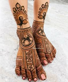 the feet are decorated with henna designs