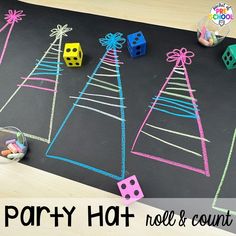 a blackboard with colored pencils and christmas trees on it next to diced toys