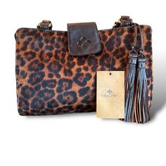 Patricia Nash Rienzo Bag Satchel Leopard Big Cat Animal Print Calf Hair Beautiful Bag By Patricia Nash. *There Is Some Tarnishing On Both Sides Of One Rivet * Please See All Photos As They Are A Part Of The Description. This Also Comes With Dust Cover. Style P357283 Color Leopard/Choc Fc: Wgi Brown Shoulder Bag With Animal Design For Daily Use, Brown Animal Design Shoulder Bag For Daily Use, Brown Rectangular Shoulder Bag With Animal Design, Luxury Rectangular Calf Hair Bag, Brown Animal Design Rectangular Shoulder Bag, Brown Calf Hair Bag For Daily Use, Brown Calf Hair Satchel Bags, Leather Satchel Shoulder Bag With Animal Design, Luxury Brown Calf Hair Bag