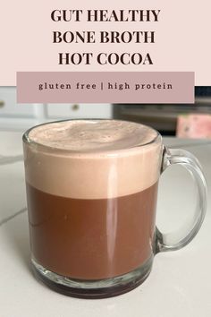 This easy healthy viral bone broth hot cocoa is gluten free, lower sugar, high protein, paleo, paleo friendly, can be dairy free, refined sugar free. In a tall clear glass mug is freshly blended and frothed hot cocoa. The bottom layer is a thick rich chocolatey drink that looks like smooth chocolate. The top layer is pure foam a light brown color freshly frothed. Gluten Free High Protein, Classic Hot Chocolate, More Protein, Gut Healing, Hot Chocolate Recipes, Healthy Bones, Clean Eats, Healthy Protein