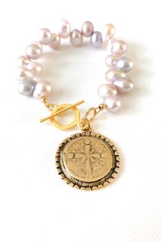 Beautiful extra shimmering freshwater pearls with a ornate gold medallion and toggle clasp Gold Round Bohemian Pearl Bracelet, Gold Bohemian Round Pearl Bracelet, Gold Round Pearl Bracelet In Bohemian Style, Gold Medallion, Toggle Clasp, Fresh Water, Freshwater Pearls, Gold