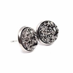 These shimmering resin druzy earrings feature sparkling Gunmetal! They are a beautiful neutral color that can match anything. The gunmetal really catches the light and shines brightly! * Size: 12mm (large) druzy  * Includes soft rubber backing * Metal settings are stainless steel, which is hypoallergenic and gentle on sensitive skin! * For hygiene reasons, no returns on earrings SHIPPING & PACKAGING: Multiple items in one order are shipped in one larger gift box. If you need individual gift boxe Bridesmaid Earrings Gift, Dark Blue Earrings, Bridesmaid Gifts Earrings, Bridesmaid Earrings Gold, Blue Stud Earrings, Rose Gold Earrings Studs, Rose Gold Studs, Druzy Earrings, Opal Studs