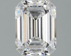 an emerald cut diamond on a gray background